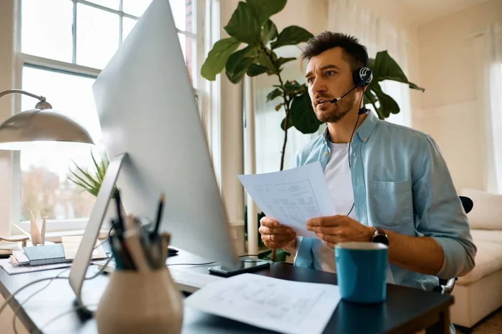 businessman talking during online video meeting while working at home office